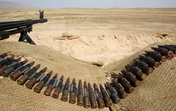 Bullets lie next to a gun at a Sinjar Resistance Units (YBS) check point, a militia affiliated with the Kurdistan Workers Party (PKK), in the village of Umm al-Dhiban, northern Iraq, April 30, 2016. REUTERS/Goran Tomasevic