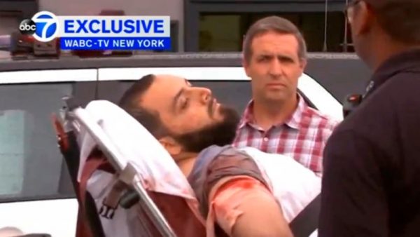 A still image captured from a video from WABC television shows a conscious man believed to be New York bombing suspect Ahmad Khan Rahami being loaded into an ambulance after a shoot-out with police in Linden, New Jersey, U.S., September 19, 2016. Courtesy WABC-TV via REUTERS