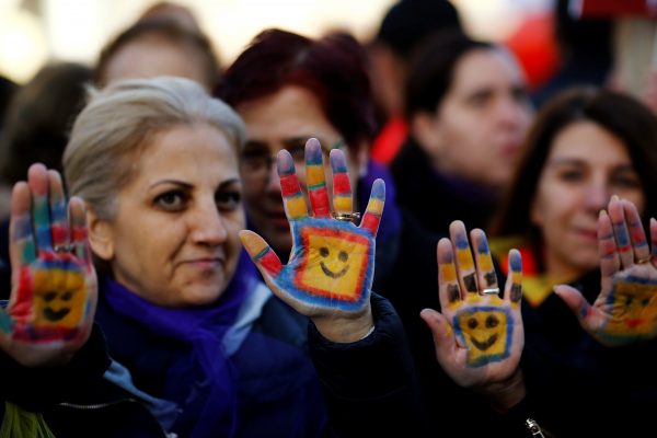 Protesters show their painted hands during a protest against a proposal that would have allowed sentencing in cases of sexual abuse committed "without force, threat or trick" before Nov. 16, 2016 to be indefinitely postponed if the perpetrator marries the victim, in front of the Turkish Parlaiment in Ankara, Turkey, November 22, 2016. REUTERS/Umit Bektas